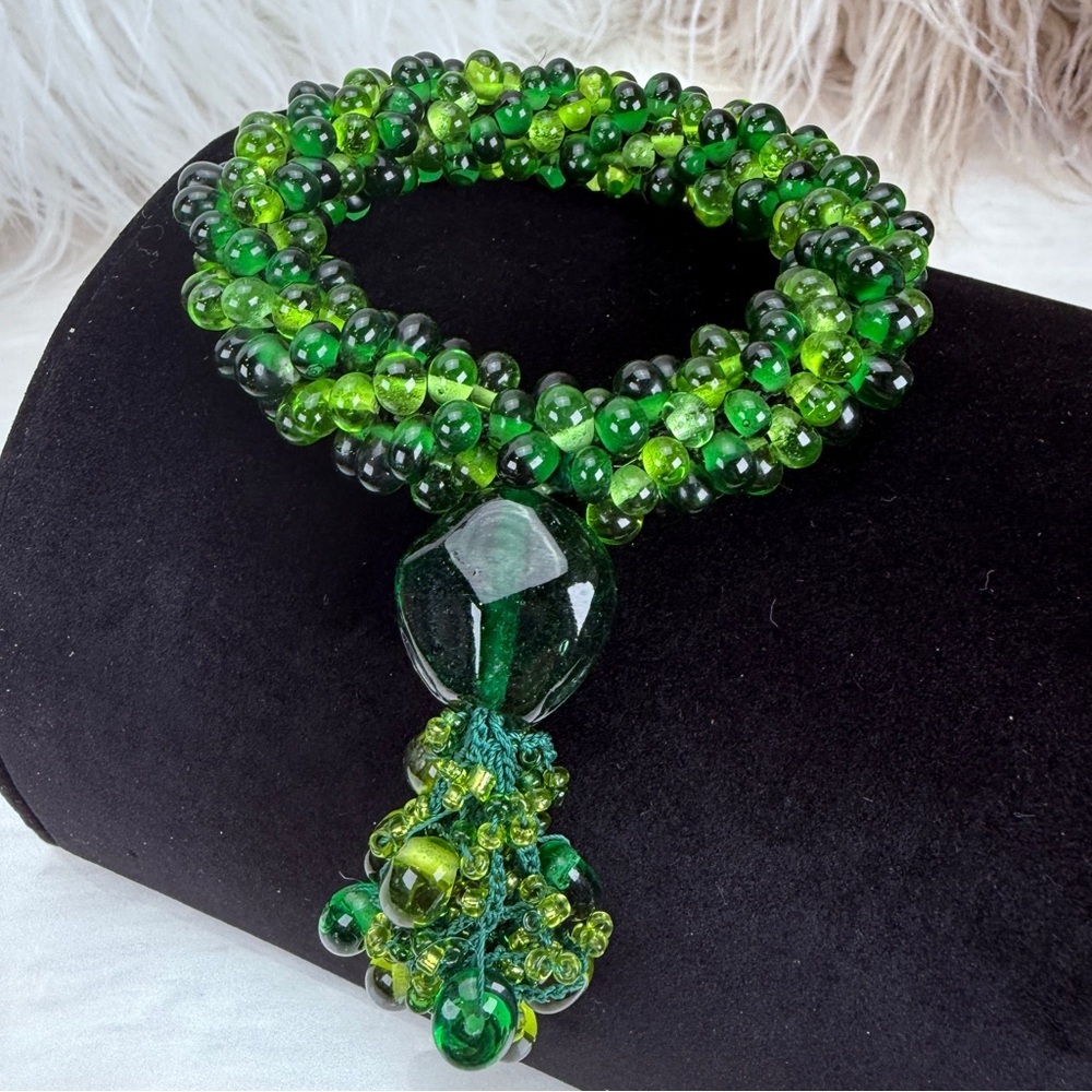 Bohemian chic, vibrant green beaded weighted vintage stretch bracelet